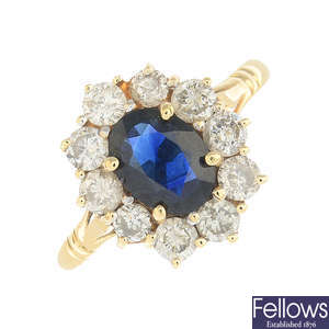 An 14ct gold sapphire and diamond cluster ring.