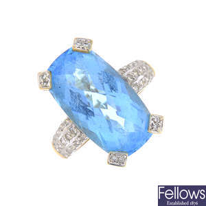 A blue topaz and diamond dress ring.