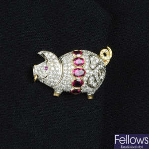 A pave-set diamond and pierced pig brooch, with pink tourmaline girdle and ruby eye.