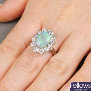 An opal and brilliant-cut diamond cluster ring.