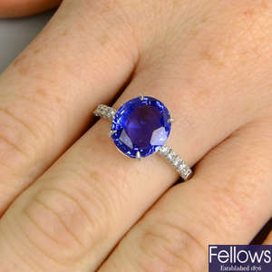 A Sri Lankan sapphire single-stone ring, with brilliant-cut diamond line shoulders.