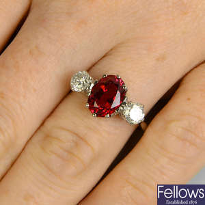 An 18ct gold red spinel and diamond three-stone ring.
