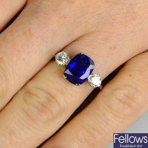 A Sri Lankan sapphire and diamond three-stone ring.