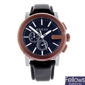 GUCCI - a gentleman's bi-colour G-Chrono chronograph wrist watch. Together with a gentleman's stainless steel Gucci G-Chrono chronograph bracelet watch.