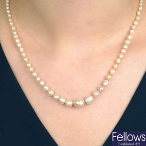 An early 20th century graduated natural pearl single-strand necklace, with diamond line clasp.