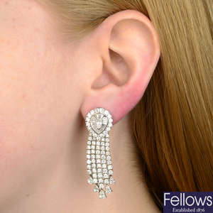 A pair of vari-cut diamond cluster fringe earrings.