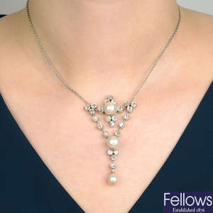 A natural pearl and diamond necklace.