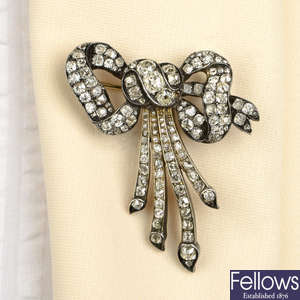 A late Victorian silver and gold diamond bow brooch.