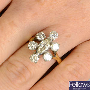 A marquise-shape and brilliant-cut diamond cluster ring.