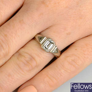 An 18ct gold rectangular-shape diamond single-stone ring, with triangular-shape diamond sides.