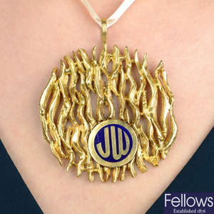 A 1970s 18ct gold and blue enamel monogrammed pendant, by Kutchinsky.