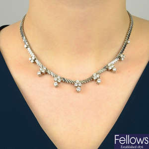 A diamond cluster fringe necklace.