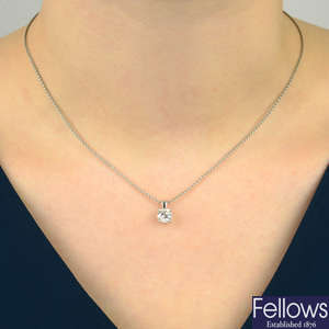 A platinum brilliant-cut diamond single-stone pendant, with platinum chain.