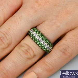An 18ct gold pave-set tsavorite garnet ring, with brilliant-cut diamond central line.