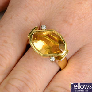 An 18ct gold fancy-cut citrine dress ring, with brilliant-cut diamond collet accents.