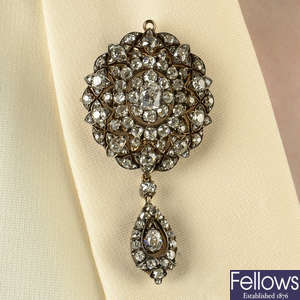 A late Victorian silver and gold rose-cut diamond floral cluster brooch/pendant, with similarly-set detachable drop.