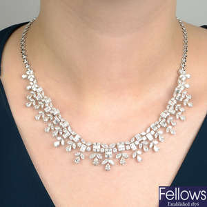 A vari-cut diamond fringe necklace, with foliate back-chain.