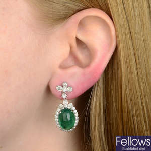 A pair of emerald and diamond drop earrings.