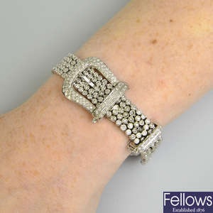 A 14ct gold brilliant-cut diamond buckle motif bracelet.