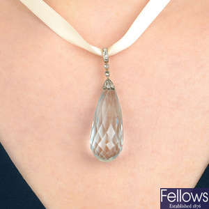 An aquamarine briolette and diamond pendant.