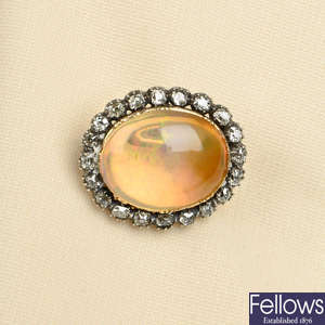A fire opal and old-cut diamond cluster brooch.