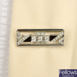 A mid 20th century diamond and onyx geometric panel brooch.