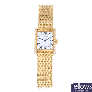 CARTIER - a lady's 18ct yellow gold diamond set Tank Louis bracelet watch.