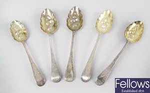 Five George III silver 'berry' table spoons, together with two Victorian examples. (7).