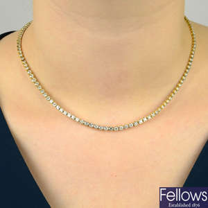 An 18ct gold graduated brilliant-cut diamond line necklace.