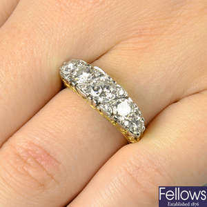 An 18ct gold brilliant-cut diamond five-stone ring, with single-cut diamond accents.