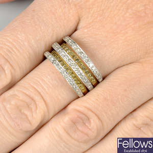 A diamond and 'yellow' diamond stepped bands dress ring.
