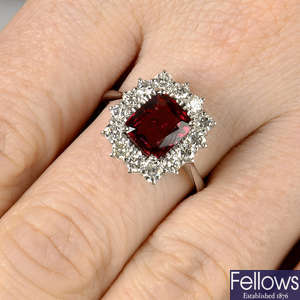 An orangey Red spinel and diamond cluster ring.