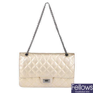 CHANEL - a metallic gold quilted 2.55 Reissue Flap 227 handbag.