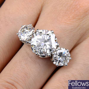 An impressive brilliant-cut diamond three-stone ring.