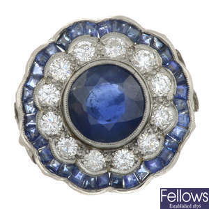 A sapphire and brilliant-cut diamond scalloped cluster ring.