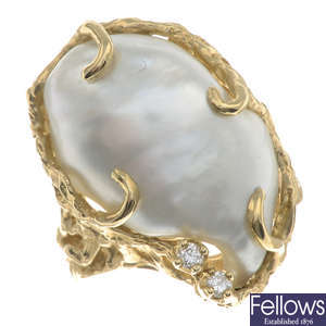 A baroque cultured pearl and brilliant-cut diamond dress ring, with openwork gallery and shoulders.