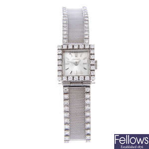 LONGINES - a lady's 18ct white gold bracelet watch.