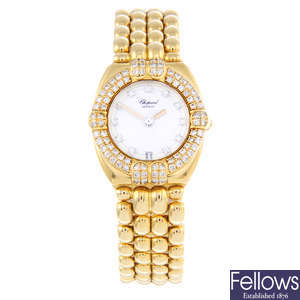 CHOPARD - a lady's 18ct yellow gold Gstaad bracelet watch.