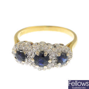 A sapphire and single-cut diamond triple cluster ring.