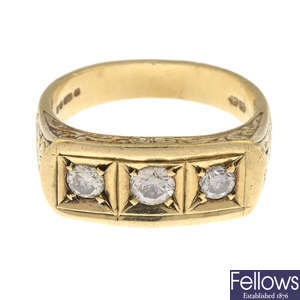 A gentleman's 9ct gold brilliant-cut diamond three-stone ring.
