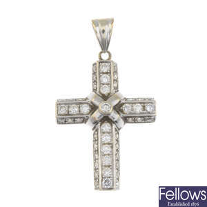 A brilliant-cut diamond cross pendant.