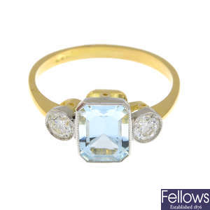An aquamarine and brilliant-cut diamond three-stone ring.