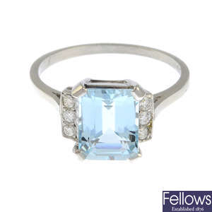 An aquamarine and brilliant-cut diamond dress ring.