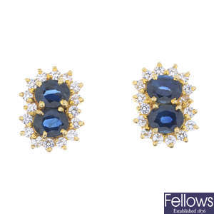 A pair of sapphire and colourless gem cluster earrings.