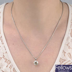 A brilliant-cut diamond single-stone pendant, suspended from a chain.