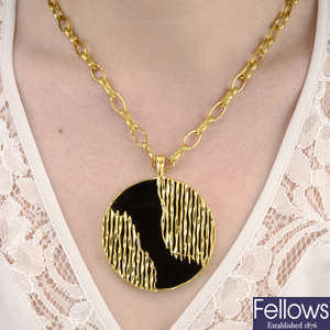 A 1970s 18ct gold onyx pendant, with chain, by Kutchinsky.