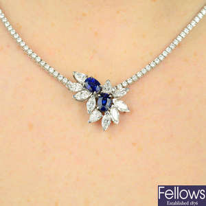 An 18ct gold diamond line necklace with detachable sapphire and diamond pendant.