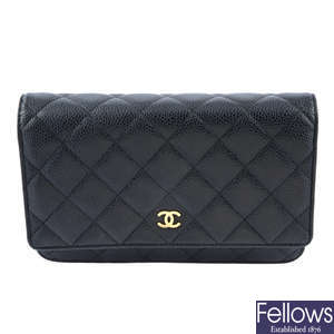CHANEL - a black leather Wallet On Chain 'WOC' handbag.