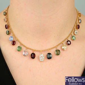 An early 20th century gold multi-gem fringe necklace.