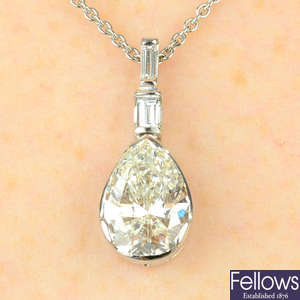 A pear-shape diamond pendant, with baguette-cut diamond highlights and 18ct gold chain.
